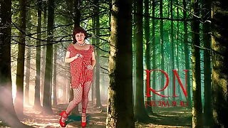 Pin-up lady posing in the forest&period; She shows her tits and pussy&period; Mesh tights&period; Regina Noir